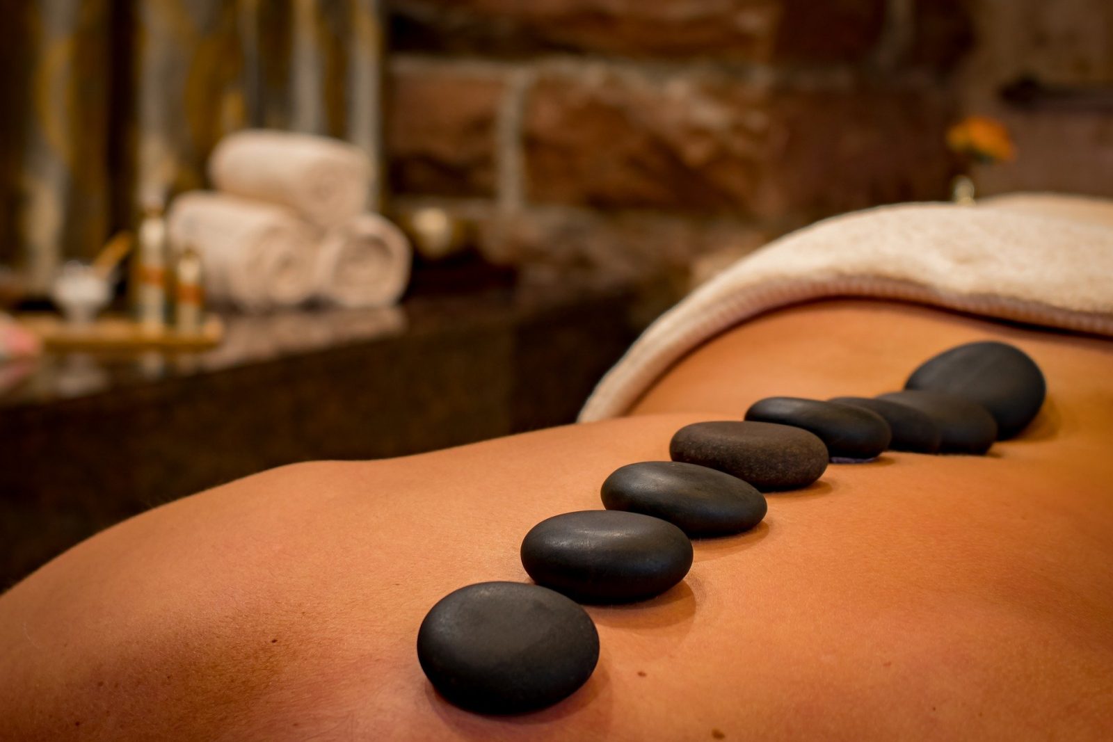 Stone Massage on a persons back