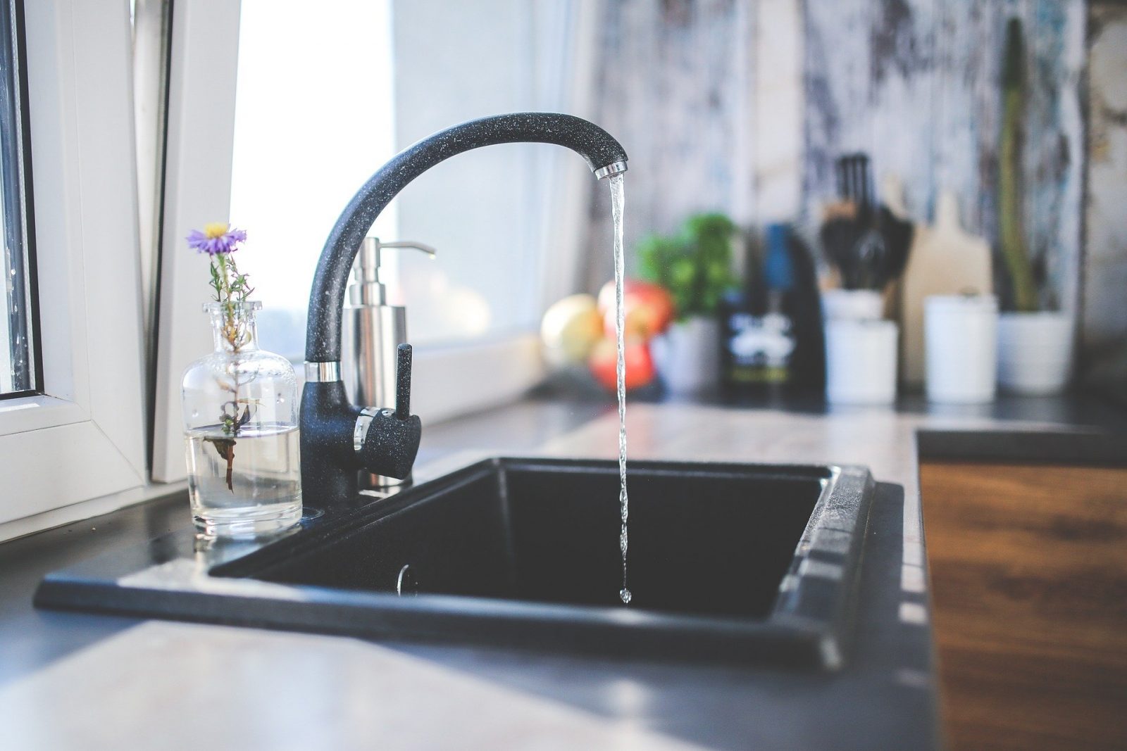 A black tap with running water